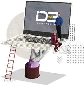 Main tenant un lapotop avec le logo d'ID-3 à l'écran et Richard avec Sylvain sur le laptop